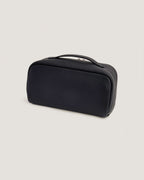 LayFlat Vanity Bag in black full grain leather, designed to hold bottles flat or upright.