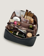 LayFlat Vanity Bag filled with cosmetics and beauty products, showcasing interior organization and water-resistant lining.
