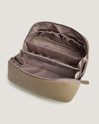 Interior view of the layflat leather vanity bag showing pockets and compartments.