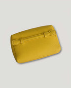 leather mini pouch in bright yellow color with textured surface, ideal for everyday essentials.