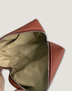 Inside view of InsideTote Mini Pouch showing spacious interior, fully lined with zipper closure, featuring mini leather pouch.