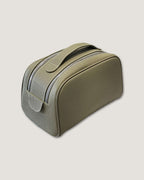 Stylish leather makeup bag made of full grain leather with double-zipper design for easy access.