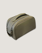 Stylish leather makeup bag in olive green with double zippers and sturdy handle for easy access.