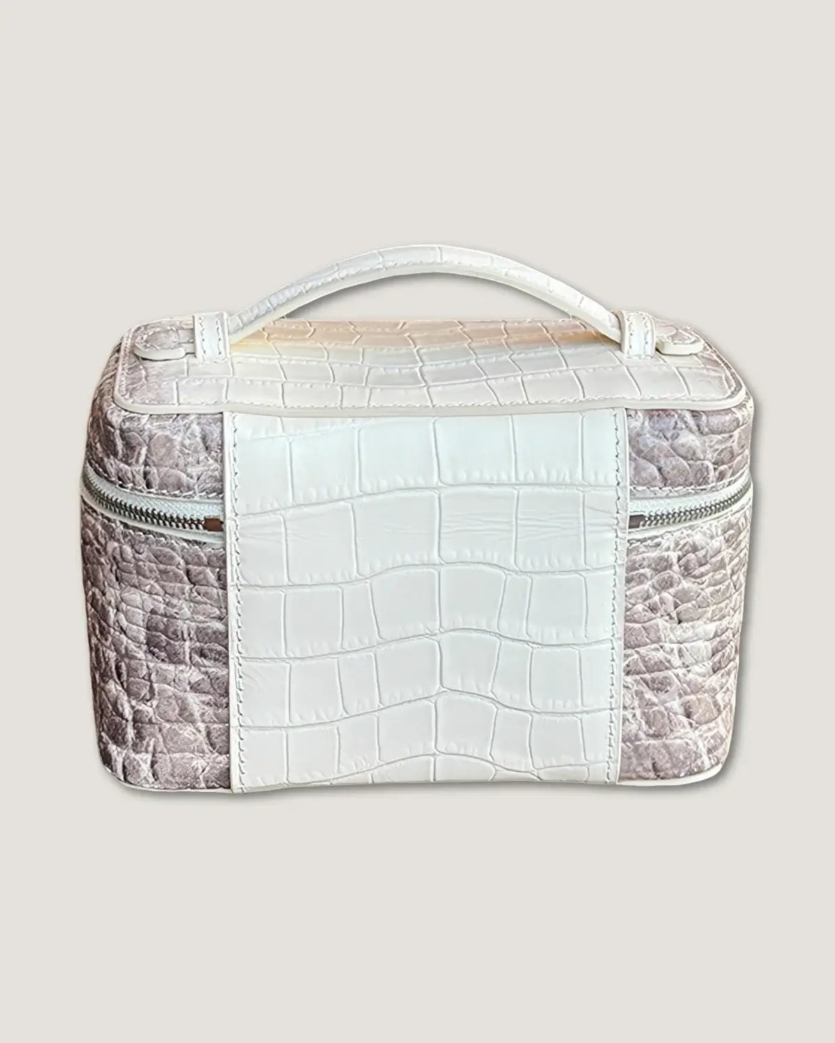 Large leather train case with a sleek crocodile pattern and handle, ideal for travel and storage.