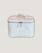 Medium Train Case with Italian leather in white crocodile pattern, featuring a zip-around closure and top handle.