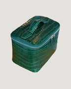 medium train case leather in green croc pattern with zip closure and top handle