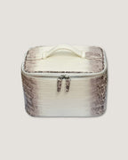 medium leather train case in white and brown with zipped closure and top handle