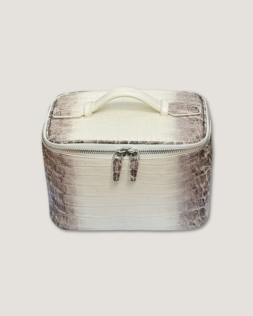 medium leather train case in white and brown with zipped closure and top handle