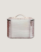 Medium leather train case in soft white Italian leather with stylish crocodile texture and zippered closure.