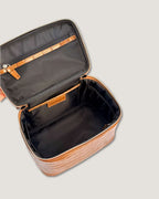 Interior view of a medium train case showing zippered pocket and spacious design for organizing beauty essentials.