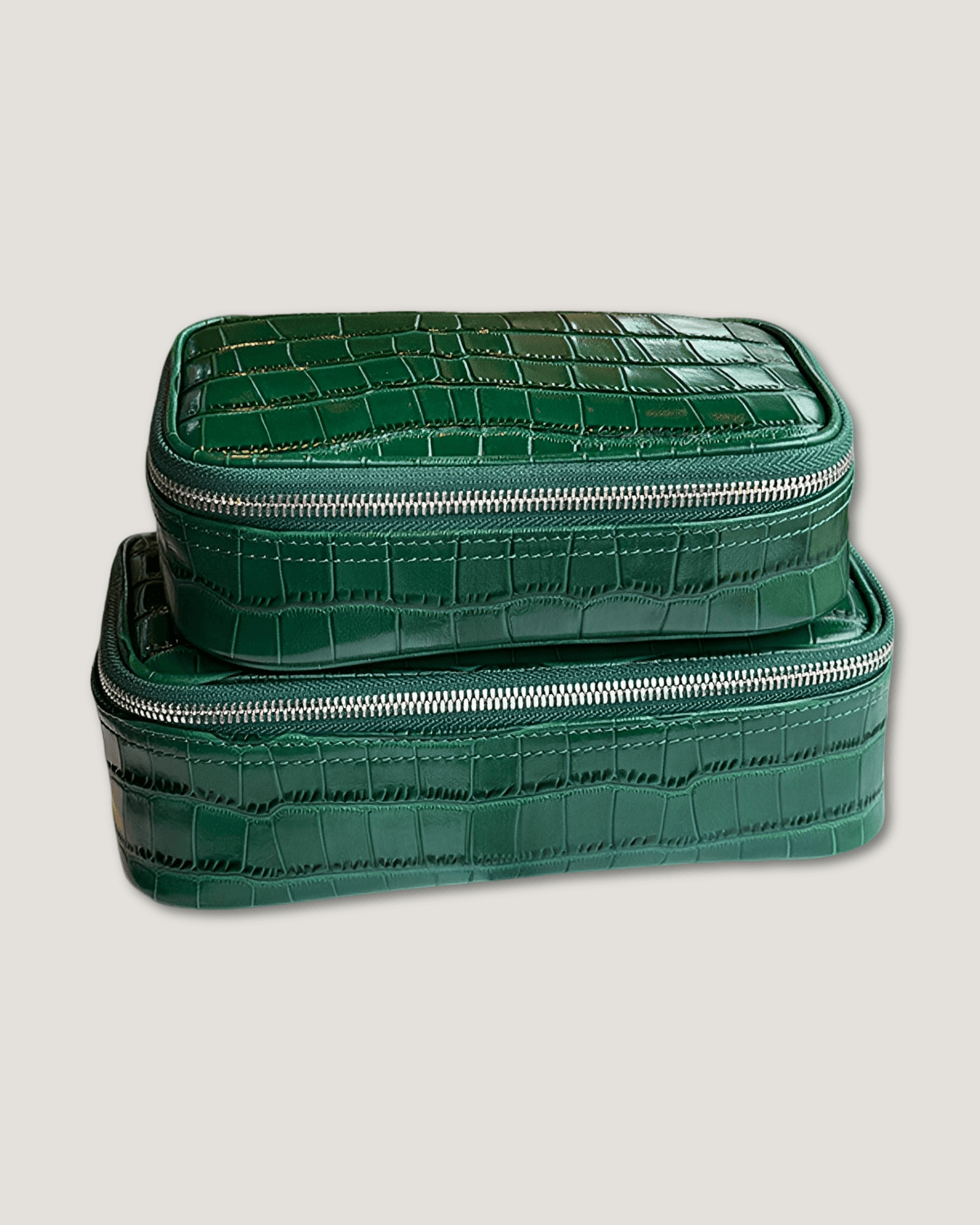 Large rectangular leather makeup bag in crocodile pattern premium green, stacked design with zip-around closure.