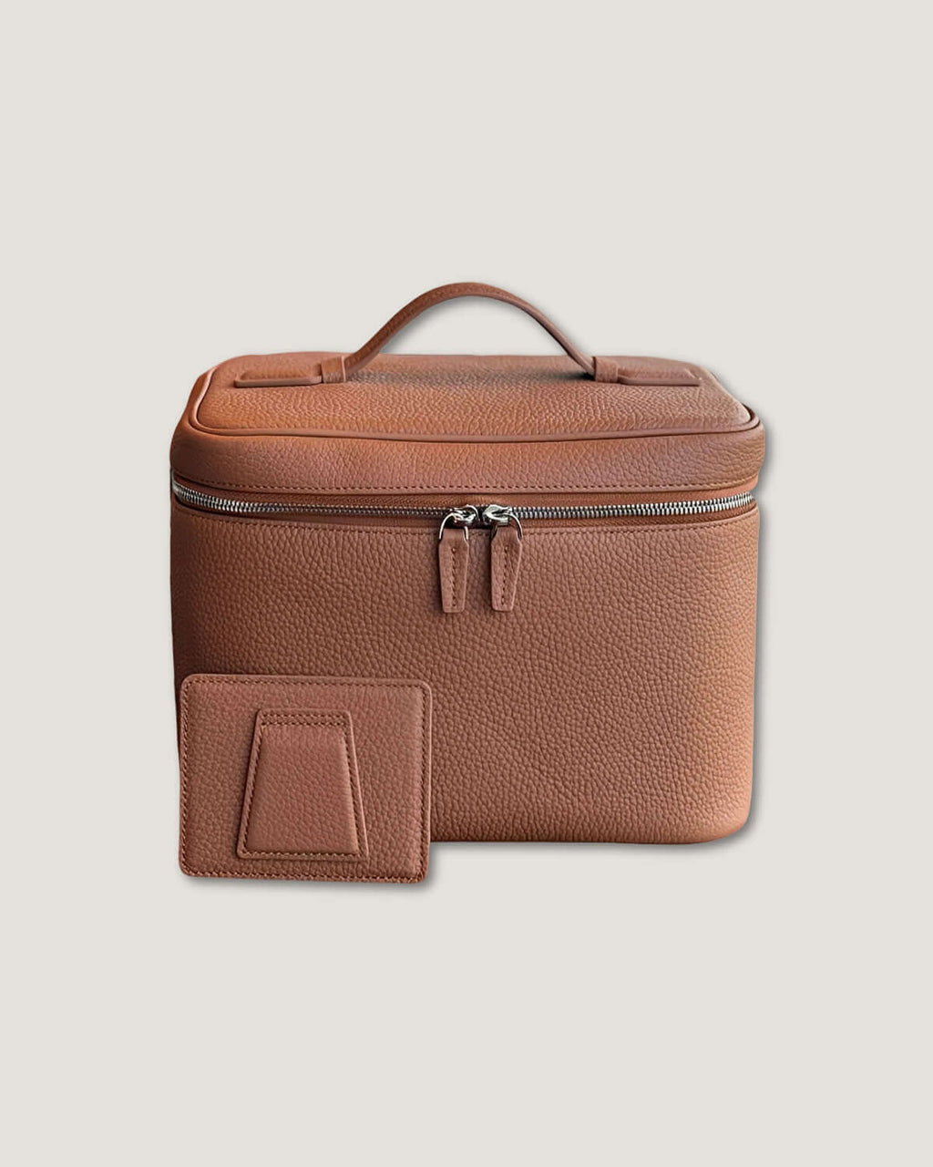 XL leather train case in full grain leather with a removable divider and a matching card holder.