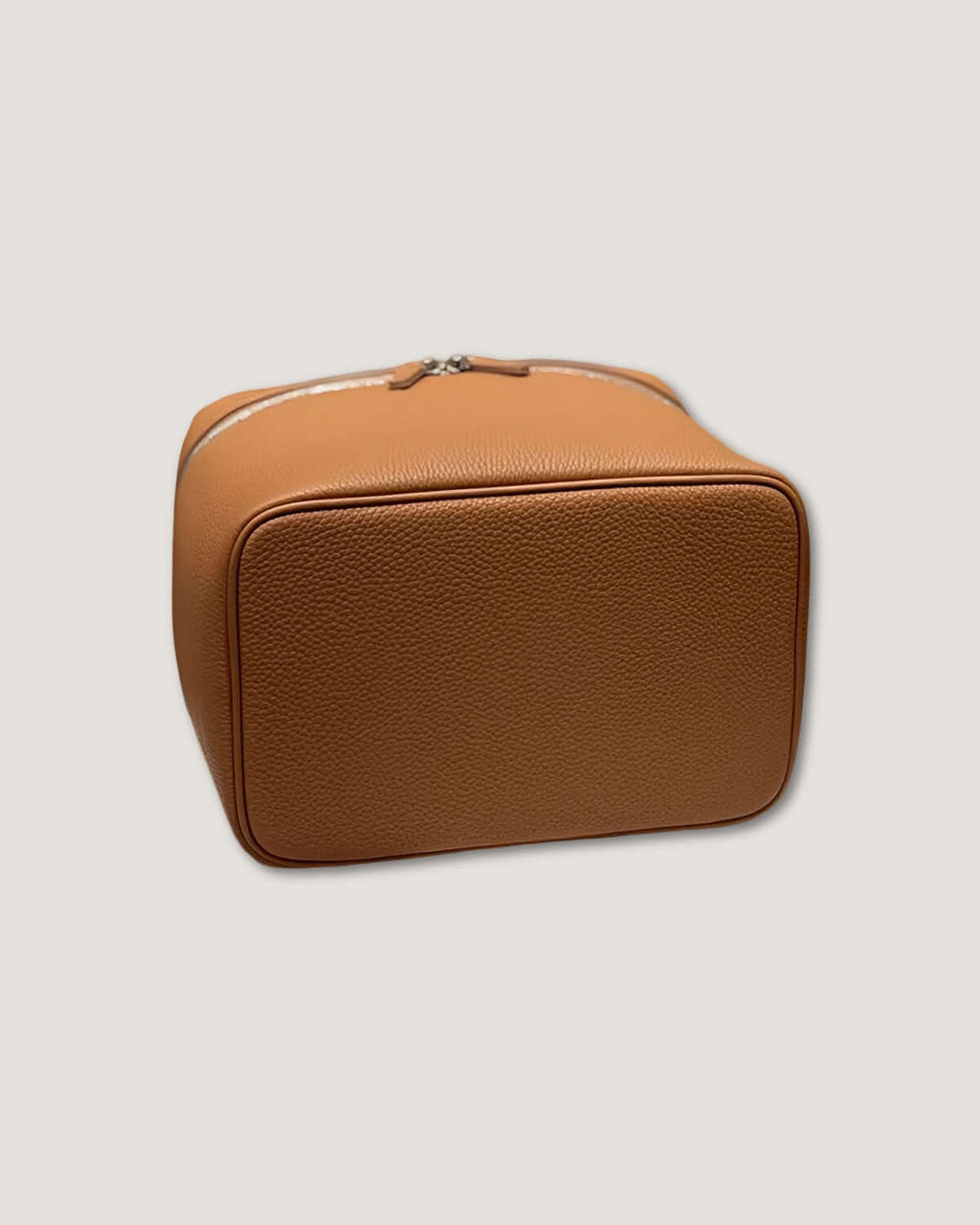 XL leather train case in tan full grain leather with zip-around closure and sleek design.