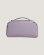 LayFlat Vanity Bag in soft lavender full grain leather with zip-around closure and handle.